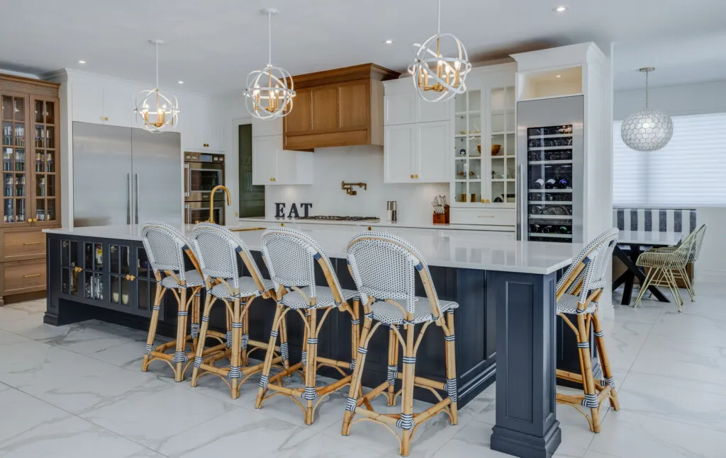 NAC custom kitchen with navy island and oak hood